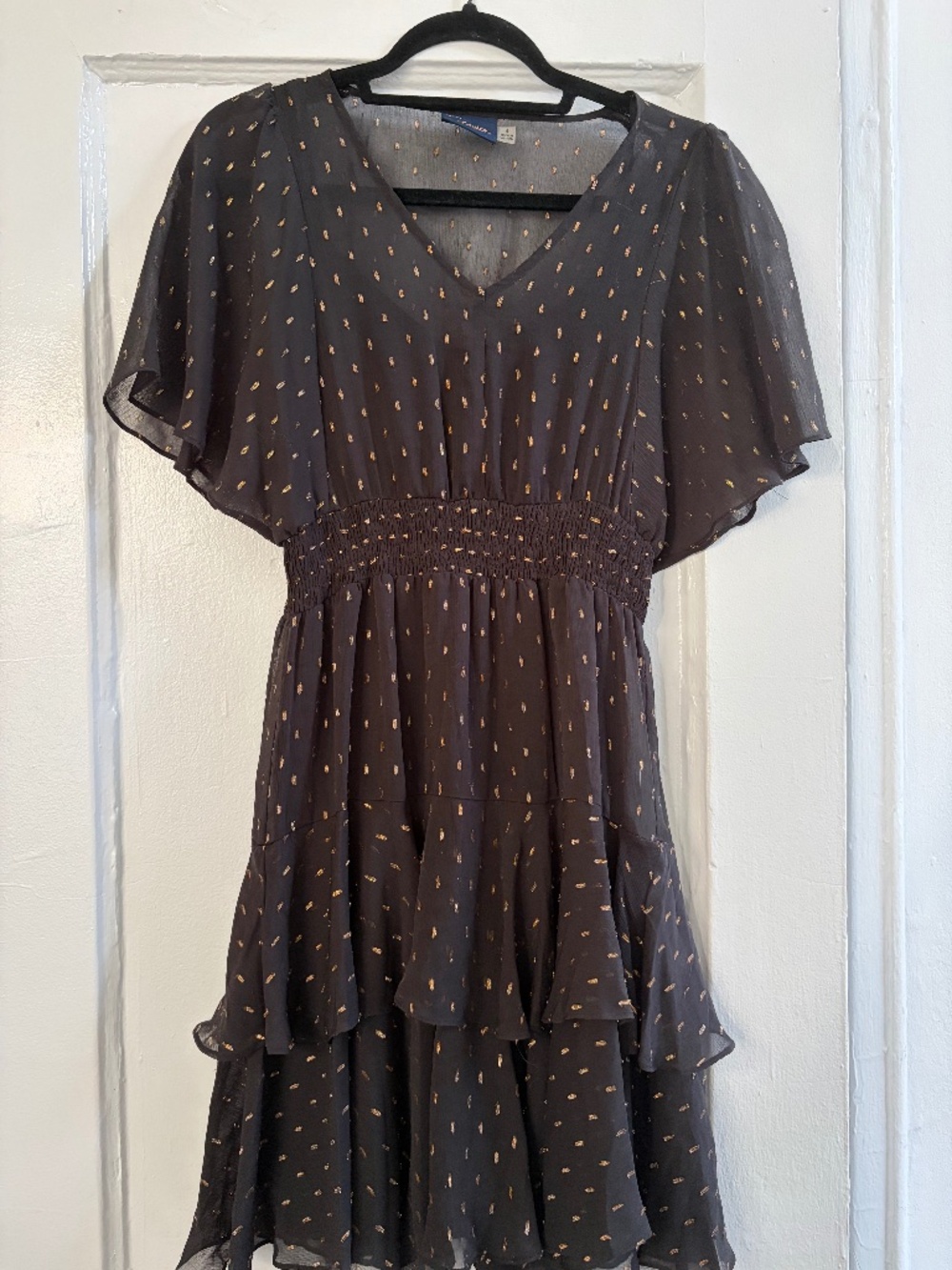 Flowy black dress with gold details